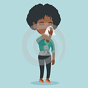 Young african-american sick woman sneezing.