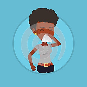 Young african-american sick woman sneezing. photo