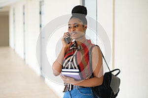 Young african american student girl smiling happy walking at university campus