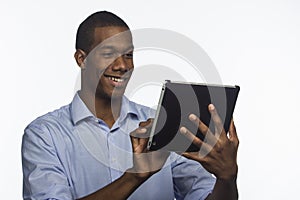 Young African American using an electronic tablet, horizontal