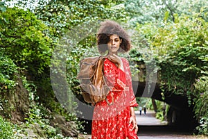 Young African American Woman with afro long curly hair traveling at Central Park, New York City