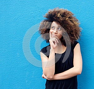 Young african american woman with afro thinking