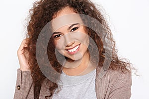 Young African-American woman with beautiful face on white background