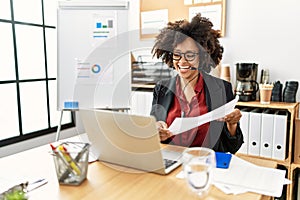 Young african american woman call center agent having video call at office