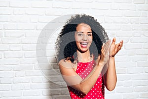 Young African American Woman Clapping Hands And Applauding