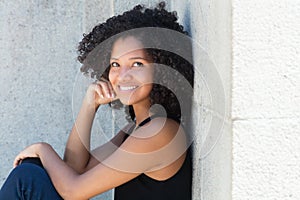 Young african american woman with curly black hair