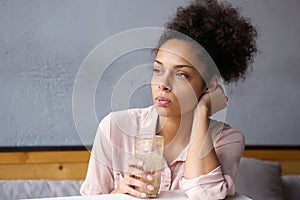 Young african american woman drinking milkshake