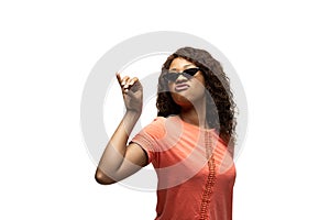 Young african-american woman with funny, unusual popular emotions and gestures isolated on white studio background