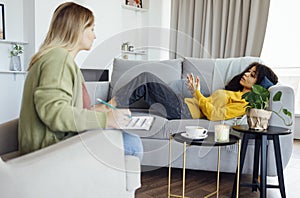 Young african american woman has session with her psychologist photo