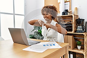 Young african american woman having video call using deaf language at office