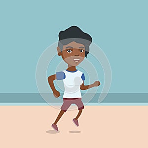 Young african-american woman jogging on the beach.