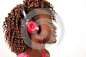 Young African American woman listening to music