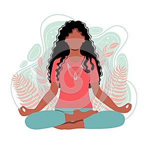 Young african american woman meditating sitting in lotus on the natural background.  Girl sitting on the nature background.