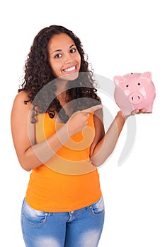 Young african american woman with piggy bank