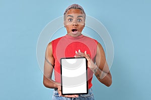 Young African American woman shows electronic tablet with white screen