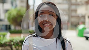 Young african american woman smiling confident wearing glasses at park