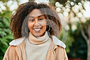 Young african american woman smiling happy standing at the park