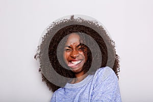 Young african american woman smiling with tongue sticking out