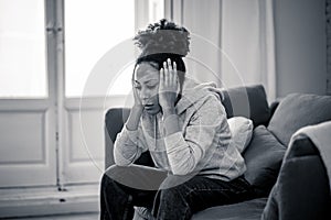 Young african american woman suffering from depression, anxiety and mental health disorders