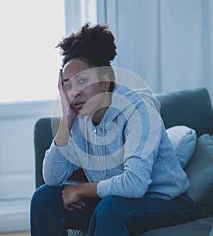 Young african american woman suffering from depression, anxiety and mental health disorders