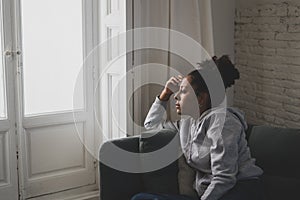 Young african american woman suffering from depression, anxiety and mental health disorders