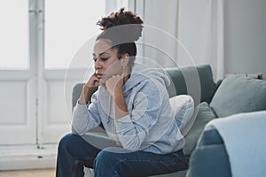 Young african american woman suffering from depression, anxiety and mental health illness