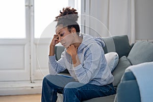 Young african american woman suffering from depression, anxiety and mental health illness