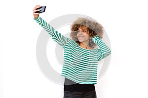 Young african american woman taking selfie with mobile phone