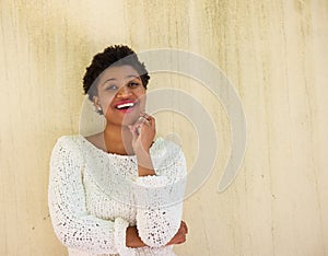 Young african american woman thinking with hand on chin