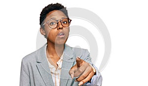 Young african american woman wearing business clothes pointing displeased and frustrated to the camera, angry and furious with you