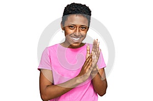 Young african american woman wearing casual clothes clapping and applauding happy and joyful, smiling proud hands together