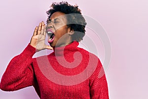 Young african american woman wearing casual clothes shouting and screaming loud to side with hand on mouth