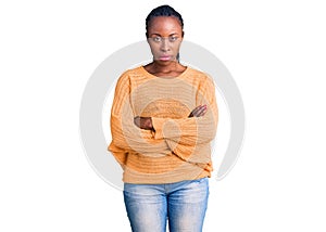 Young african american woman wearing casual clothes skeptic and nervous, disapproving expression on face with crossed arms