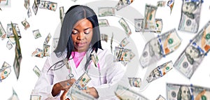 Young african american woman wearing doctor stethoscope checking the time on wrist watch, relaxed and confident