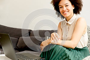 Young african american woman web-surfing internet