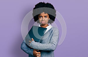 Young african american woman working using computer laptop depressed and worry for distress, crying angry and afraid