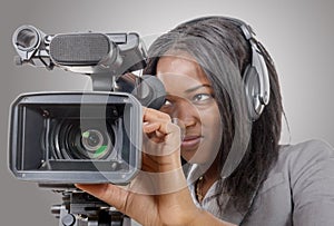 Young African American women with professional video camera and