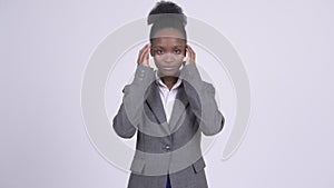 Young African businesswoman covering ears as three wise monkeys concept