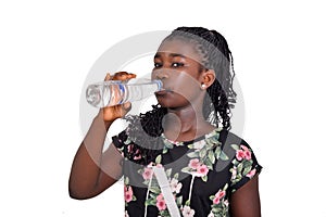 Young African girl with a bottle of mineral water