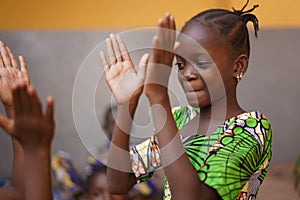 Young African Girl Concentrating On Her Hand Clapping Game