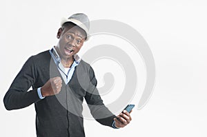 Young african guy looking at cell phone