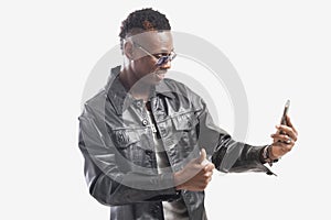 Young african guy looking at cell phone