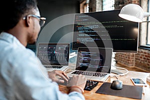 Programmer working with program code photo