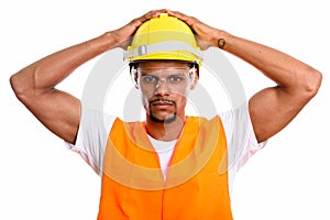 Young African man construction worker with both hands on safety