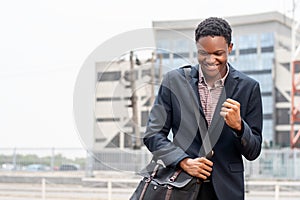 Young African man feeling very happy. Career, job offer.