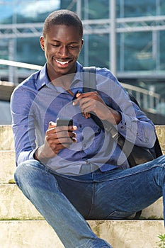 Young african man with mobile phone