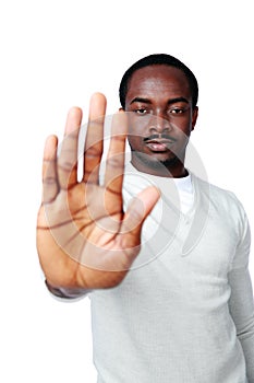 Young african man showing stop sign with hand