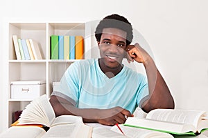 Young African Man Studying