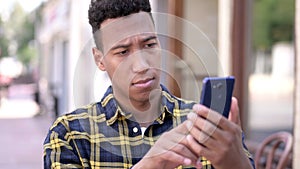 The Young African Man Using Smartphone, Outdoor