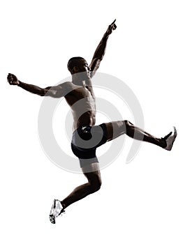 Young african muscular build man jumping running silhouette